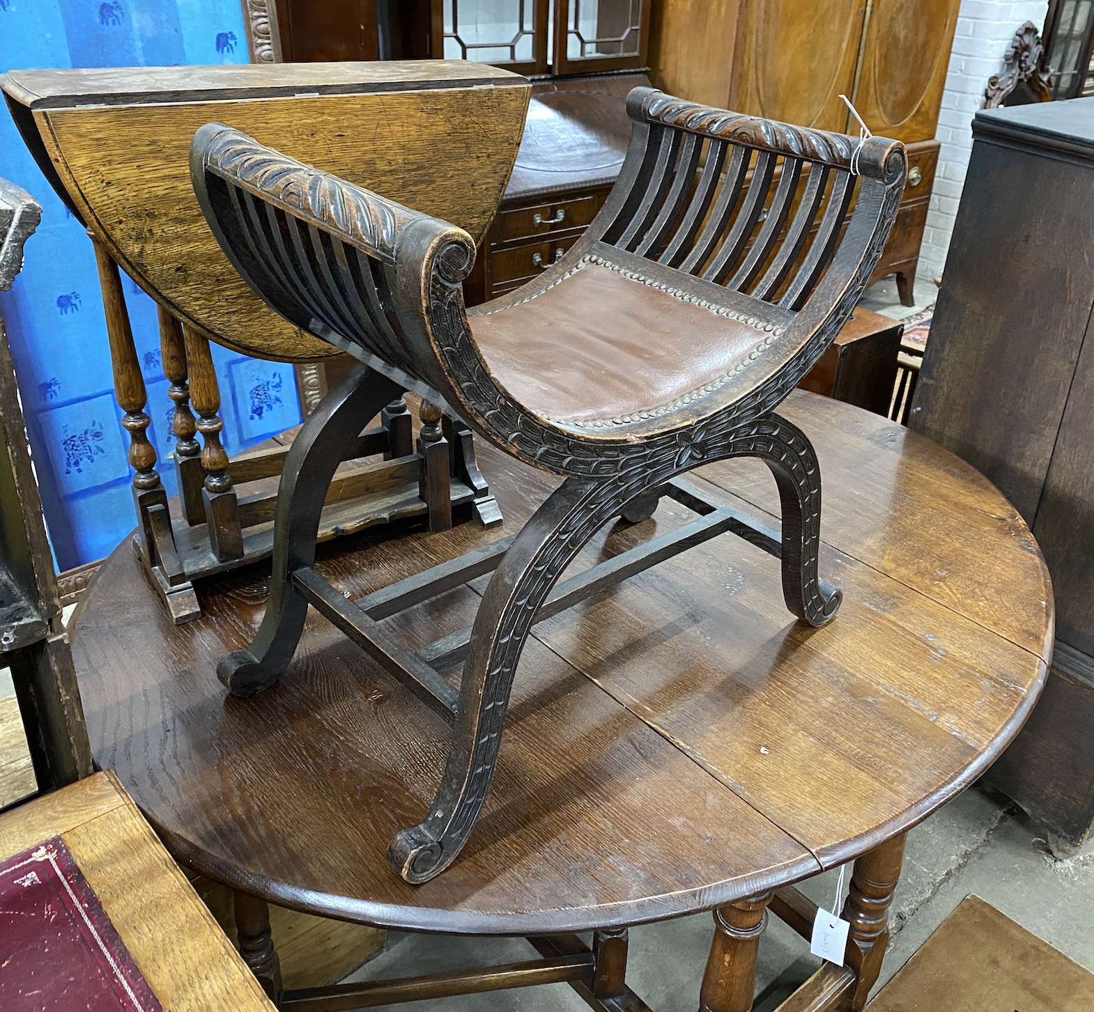 An Edwardian beech 'X' frame dressing stool, width 58cm, height 60cm, together with a small 1920's oak drop flap occasional table